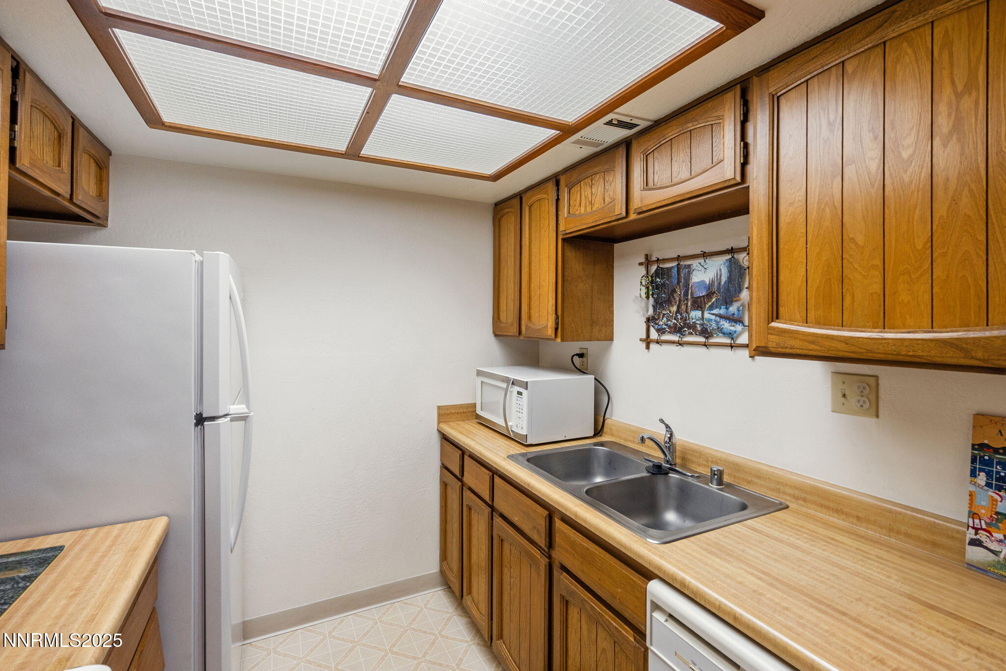2282 Cannonball Road Sparks, NV 89431 - Photo 7 of 21 a kitchen with stainless steel appliances granite countertop a sink and a refrigerator
