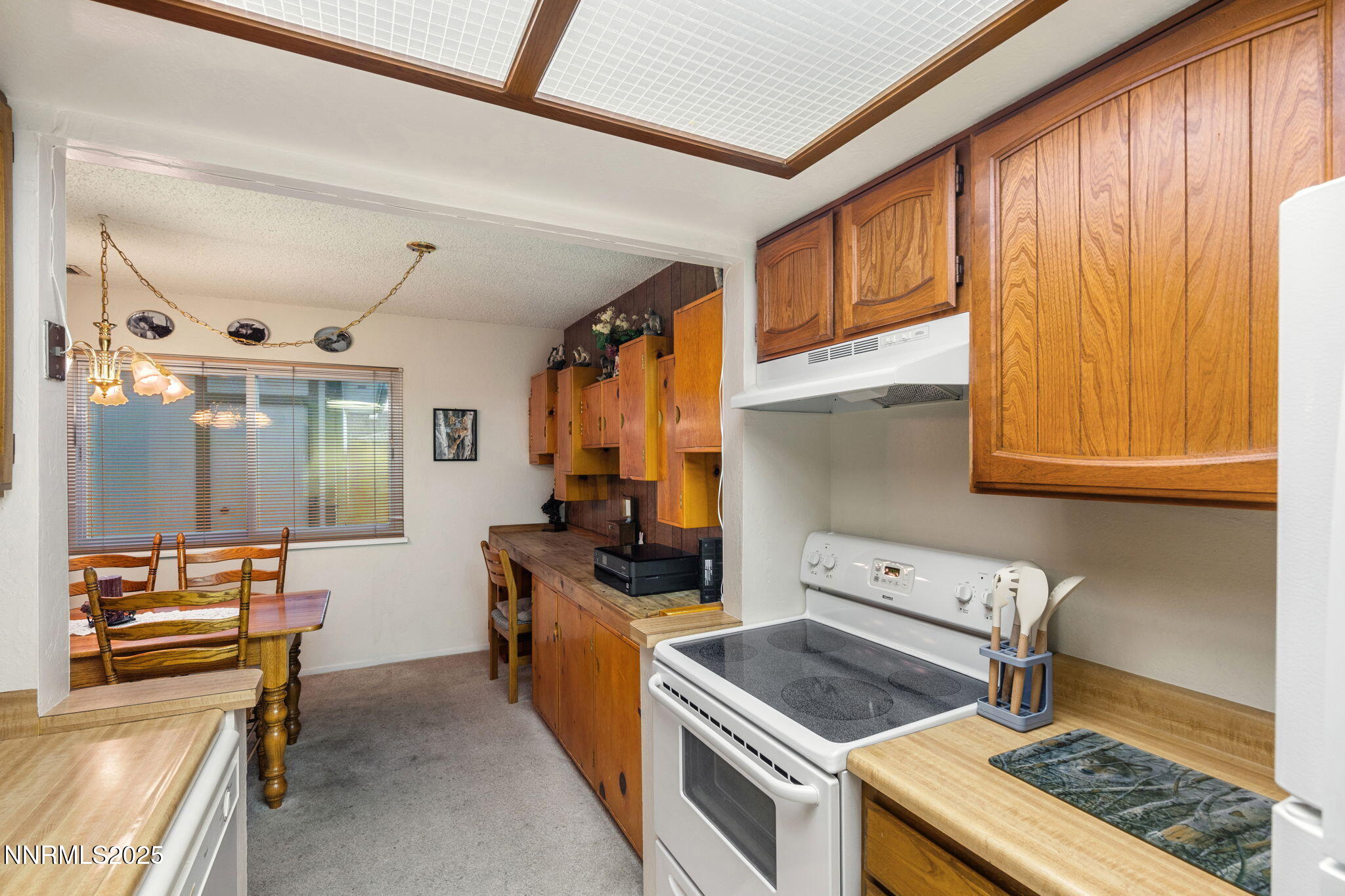 2282 Cannonball Road Sparks, NV 89431 - Photo 8 of 21 a kitchen with stainless steel appliances granite countertop a stove and a refrigerator