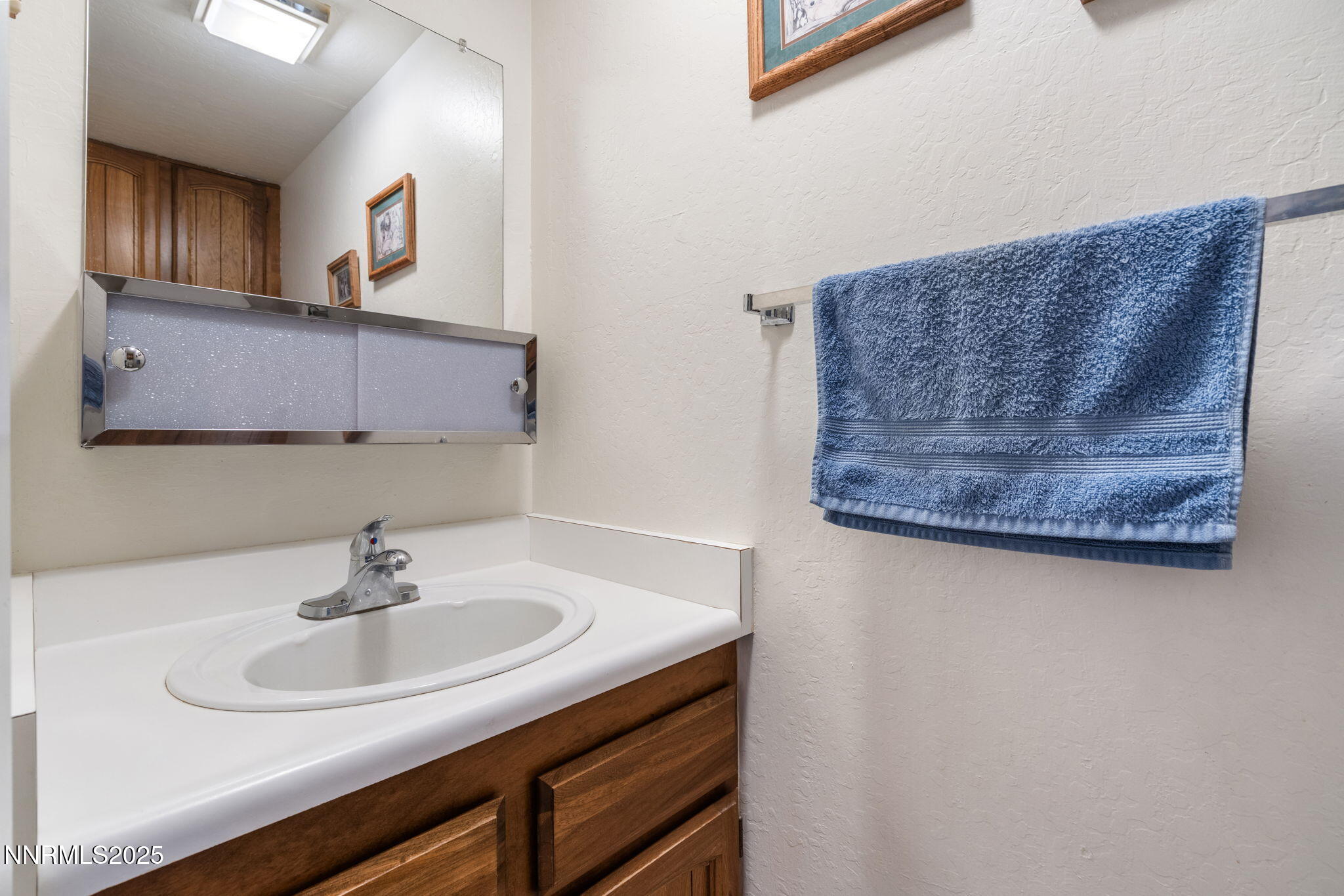 2282 Cannonball Road Sparks, NV 89431 - Photo 9 of 21 a bathroom with a sink and a mirror