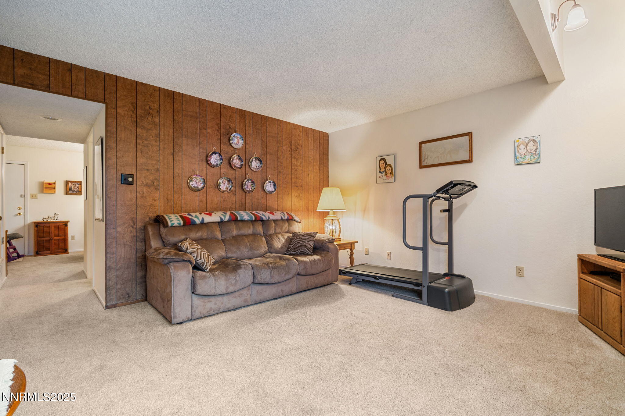 2282 Cannonball Road Sparks, NV 89431 - Photo 10 of 21 a bedroom with furniture and a flat screen tv