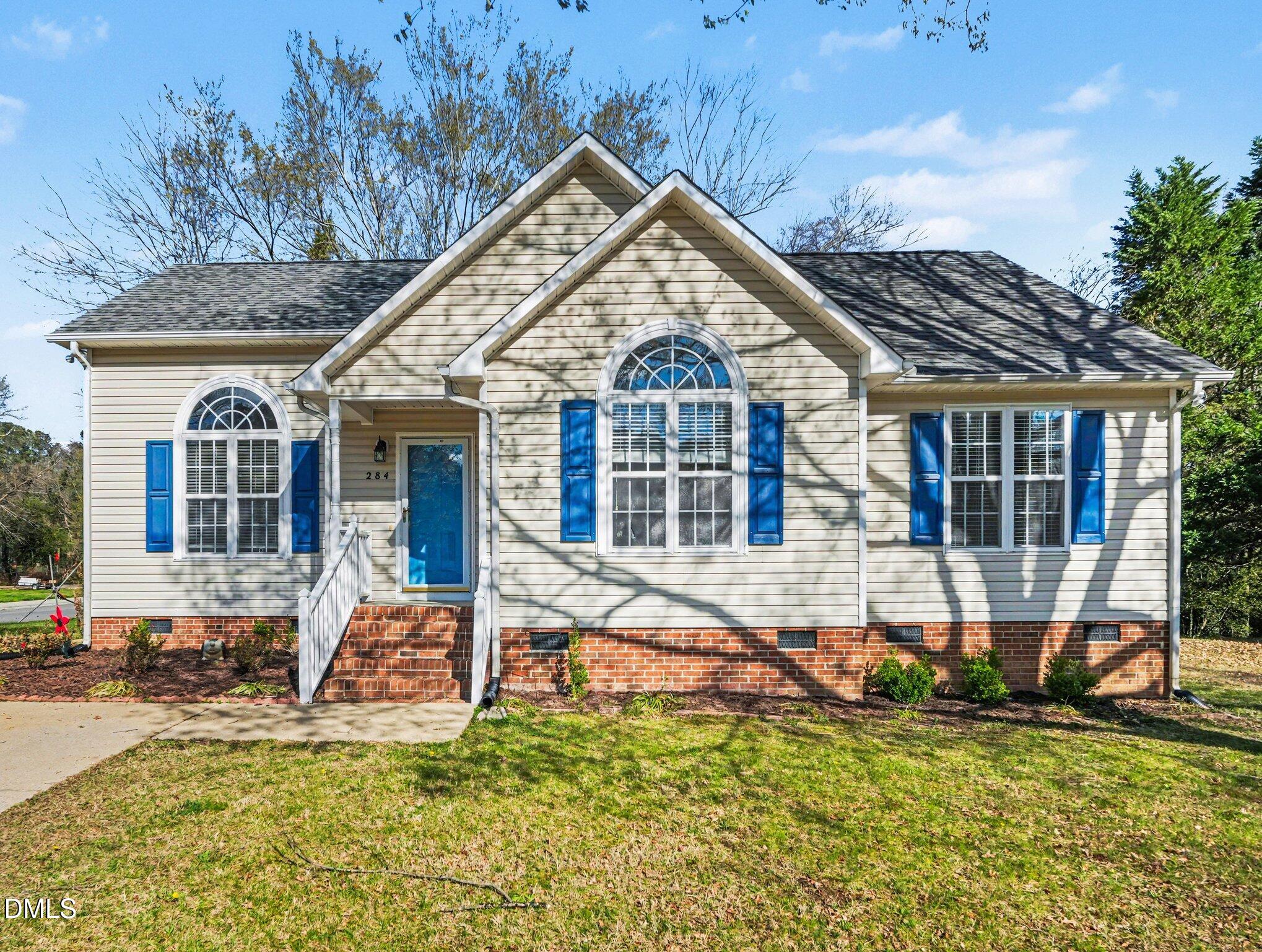 a view of a house with a yard