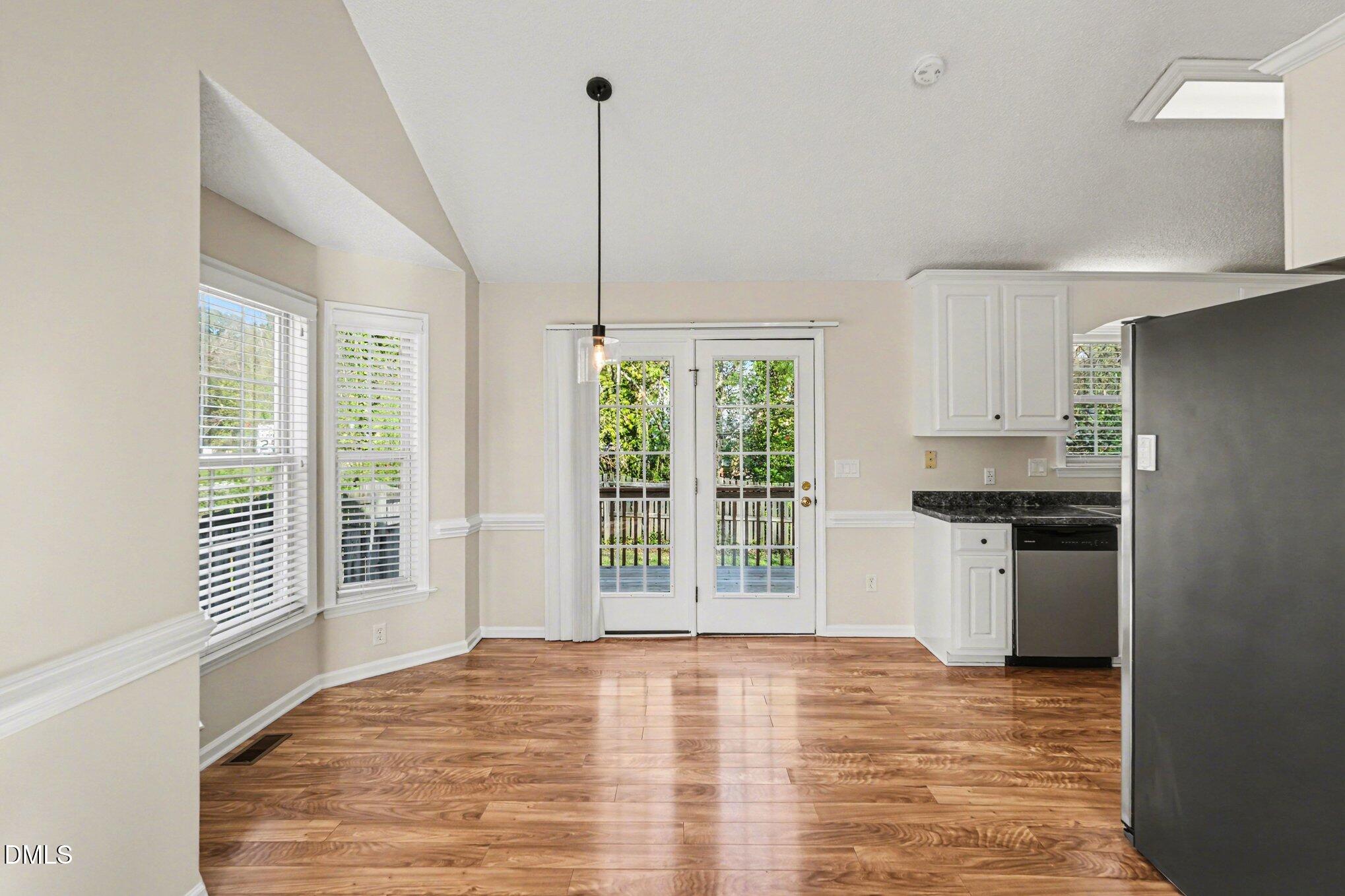 284 Dullis Circle Garner, NC 27529 - Photo 15 of 35 a view of a kitchen with a stove cabinets and a window