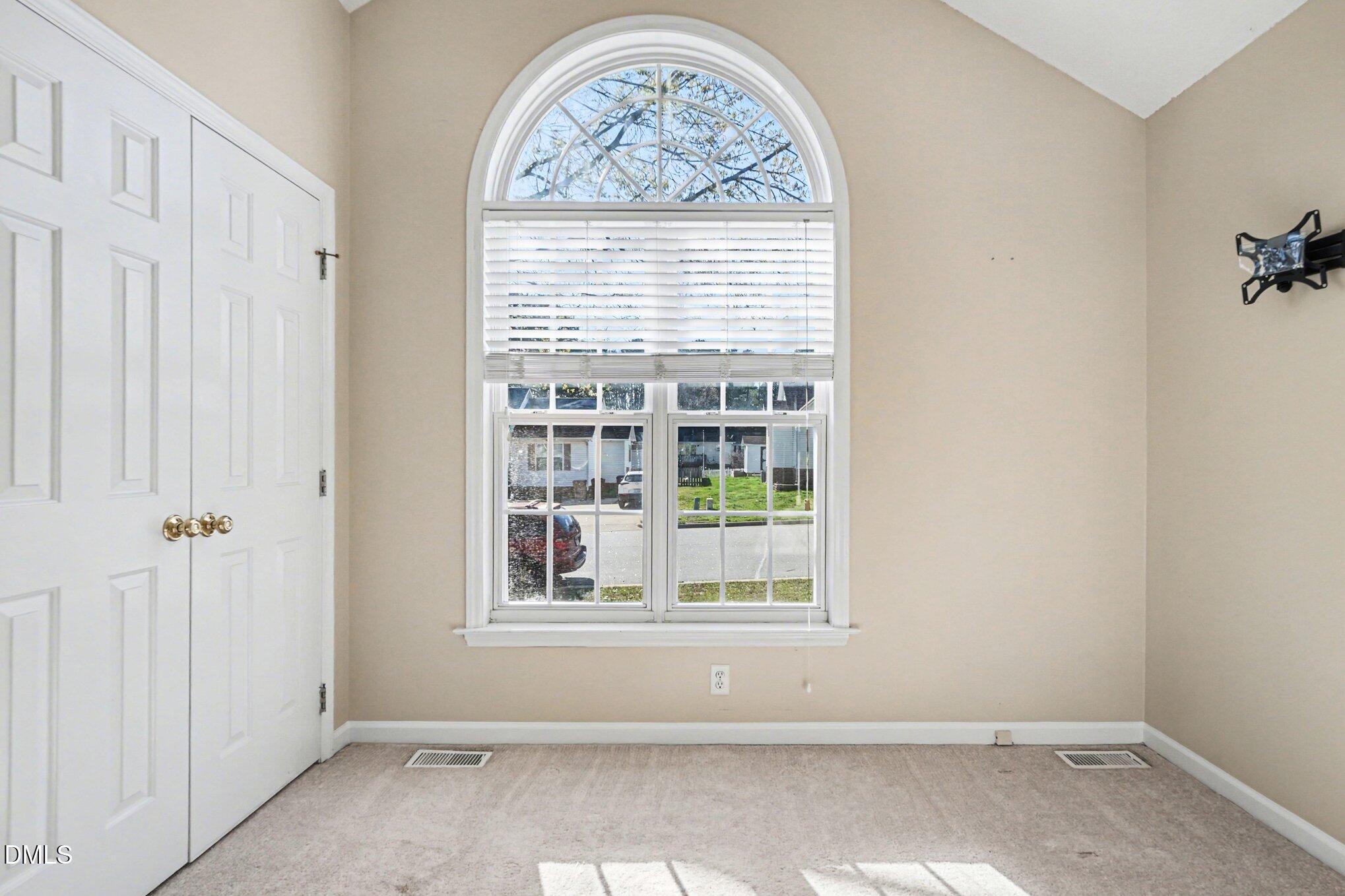284 Dullis Circle Garner, NC 27529 - Photo 16 of 35 an empty room with windows
