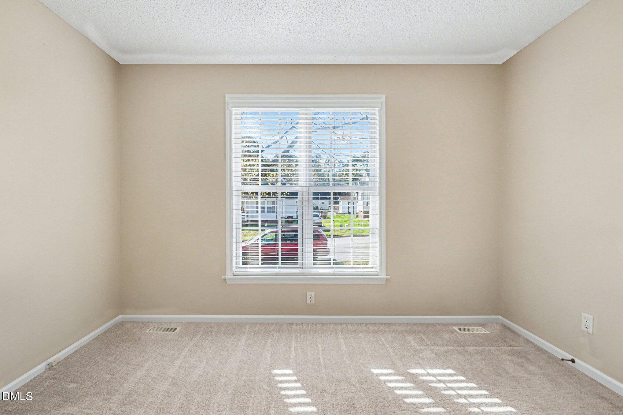 284 Dullis Circle Garner, NC 27529 - Photo 18 of 35 an empty room with a window