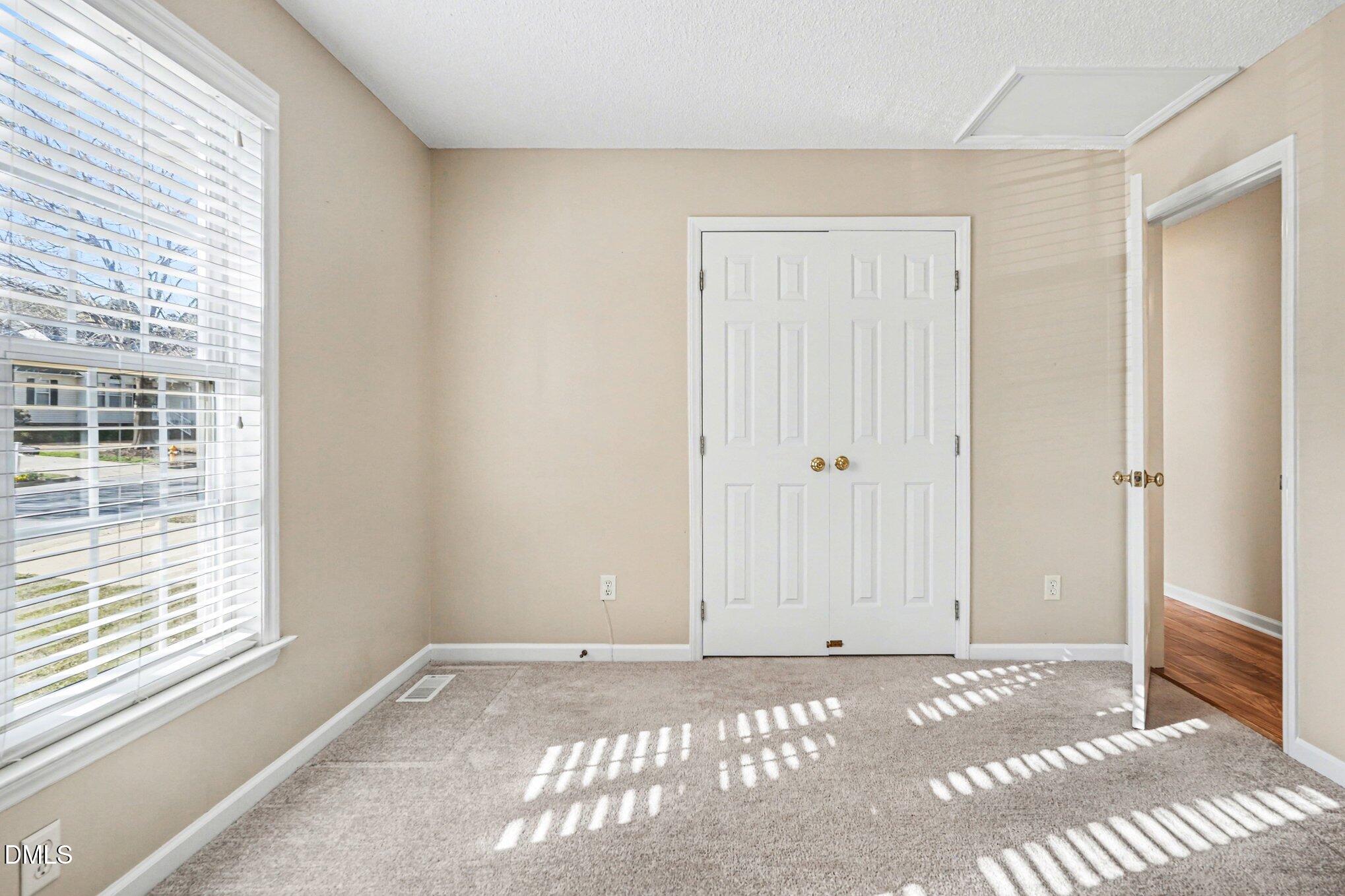 284 Dullis Circle Garner, NC 27529 - Photo 19 of 35 a view of an empty room with a window