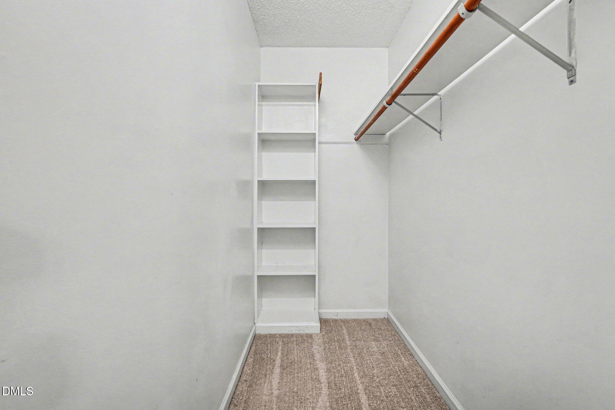 284 Dullis Circle Garner, NC 27529 - Photo 24 of 35 a view of a room with shelf