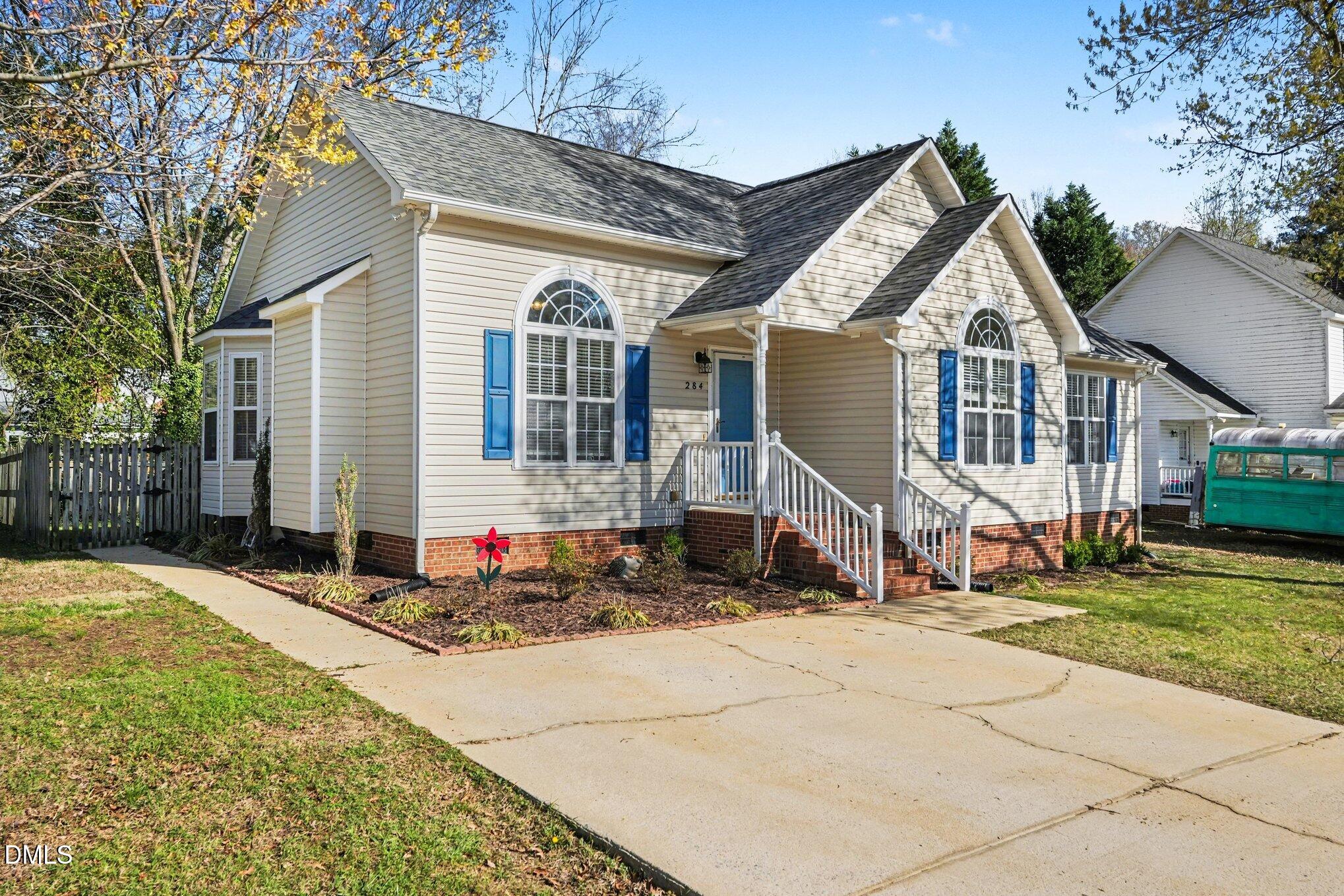 284 Dullis Circle Garner, NC 27529 - Photo 3 of 35 a front view of a house with a yard