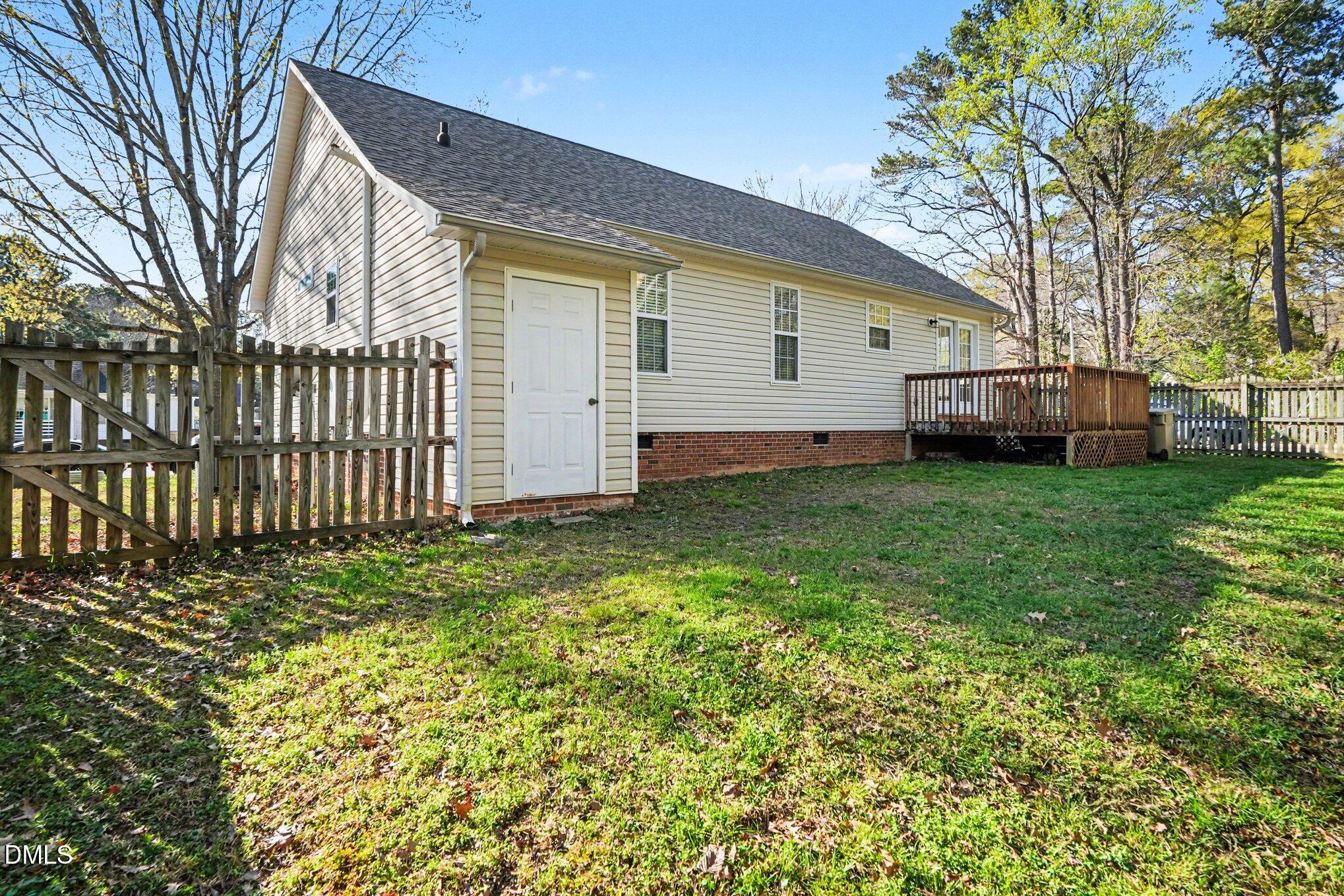 284 Dullis Circle Garner, NC 27529 - Photo 31 of 35 a view of a backyard with a garden