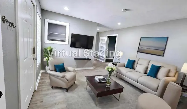 a living room with furniture and a flat screen tv