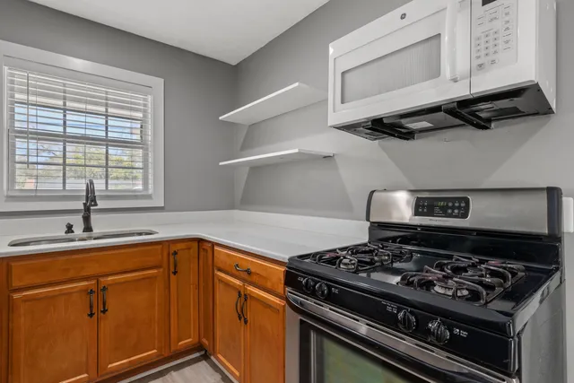 a kitchen with a stove and a sink