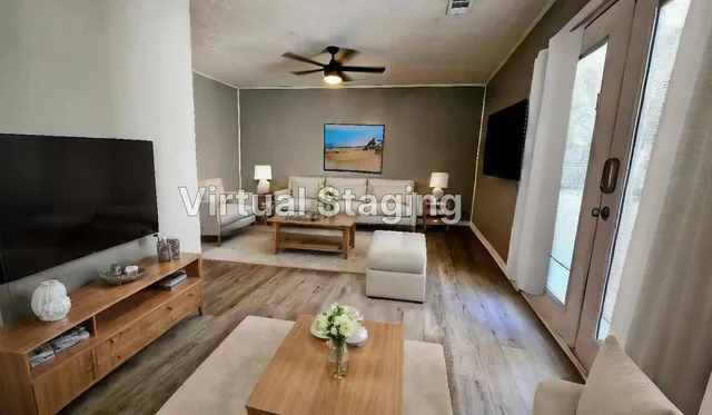 a living room with furniture and a flat screen tv