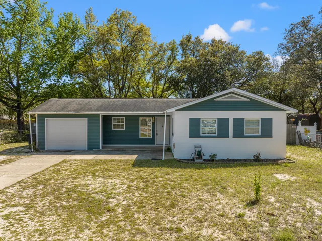 a front view of a house with yard