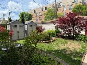 a view of a house with a yard and plants