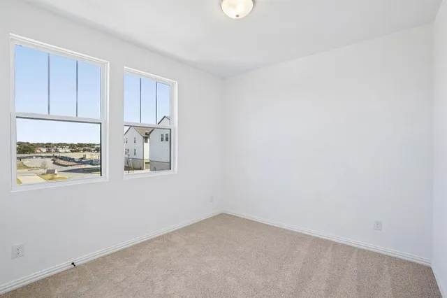 a view of an empty room with closet