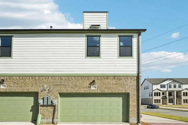 a kitchen with a stove sink and a refrigerator