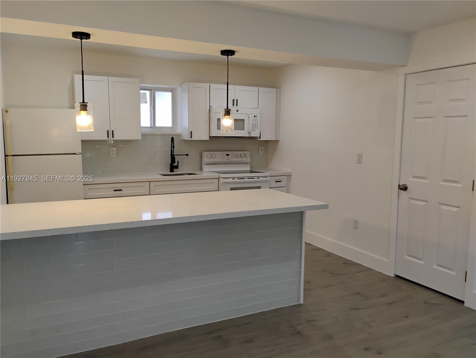 2155 Southwest 72nd Avenue Miami, FL 33155 - Photo 2 of 10 a bathroom with a sink a mirror and a shower