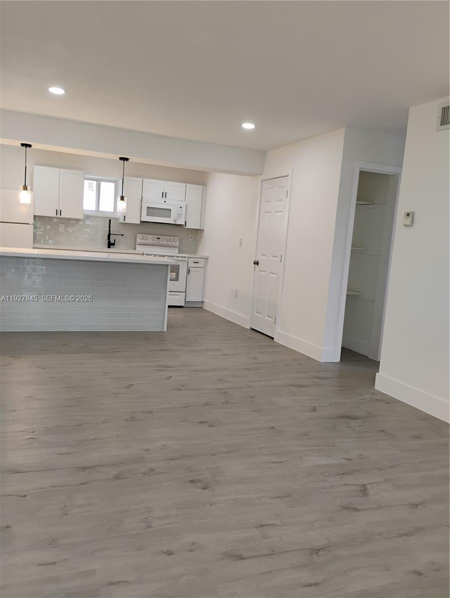 2155 Southwest 72nd Avenue Miami, FL 33155 - Photo 3 of 11 a view of kitchen with wooden floor