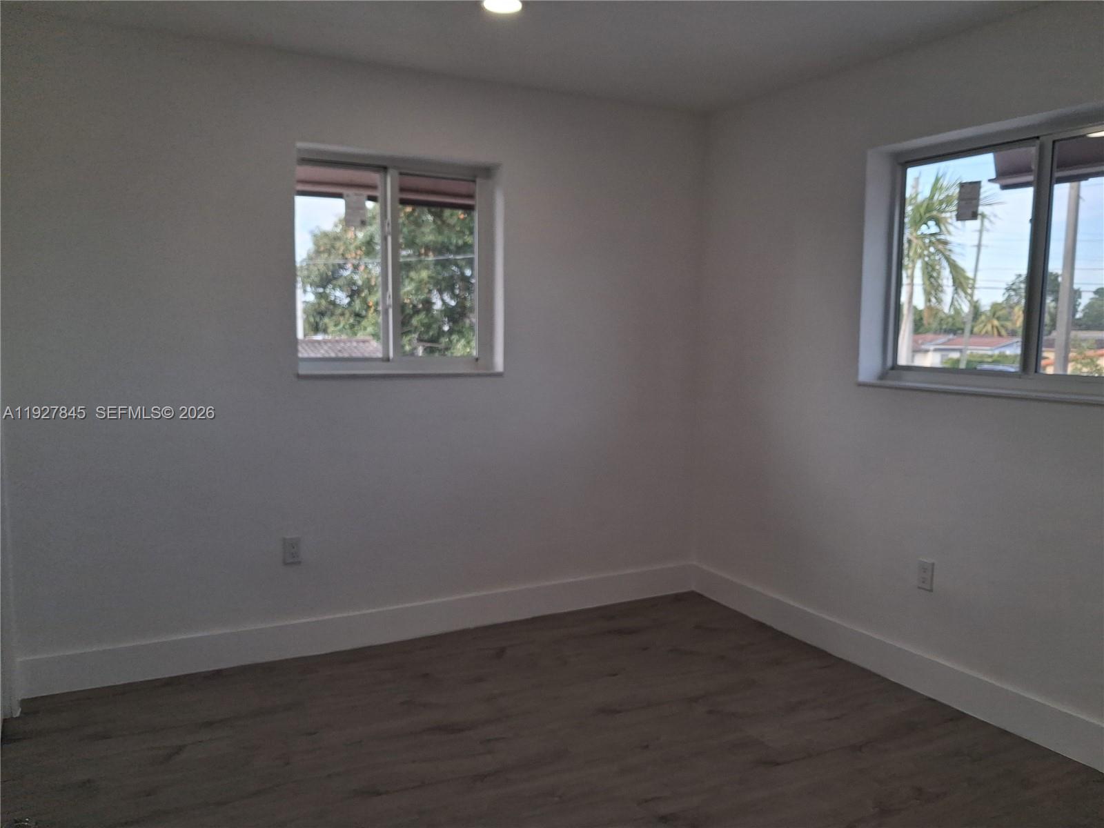 2155 Southwest 72nd Avenue Miami, FL 33155 - Photo 4 of 11 an empty room with a window