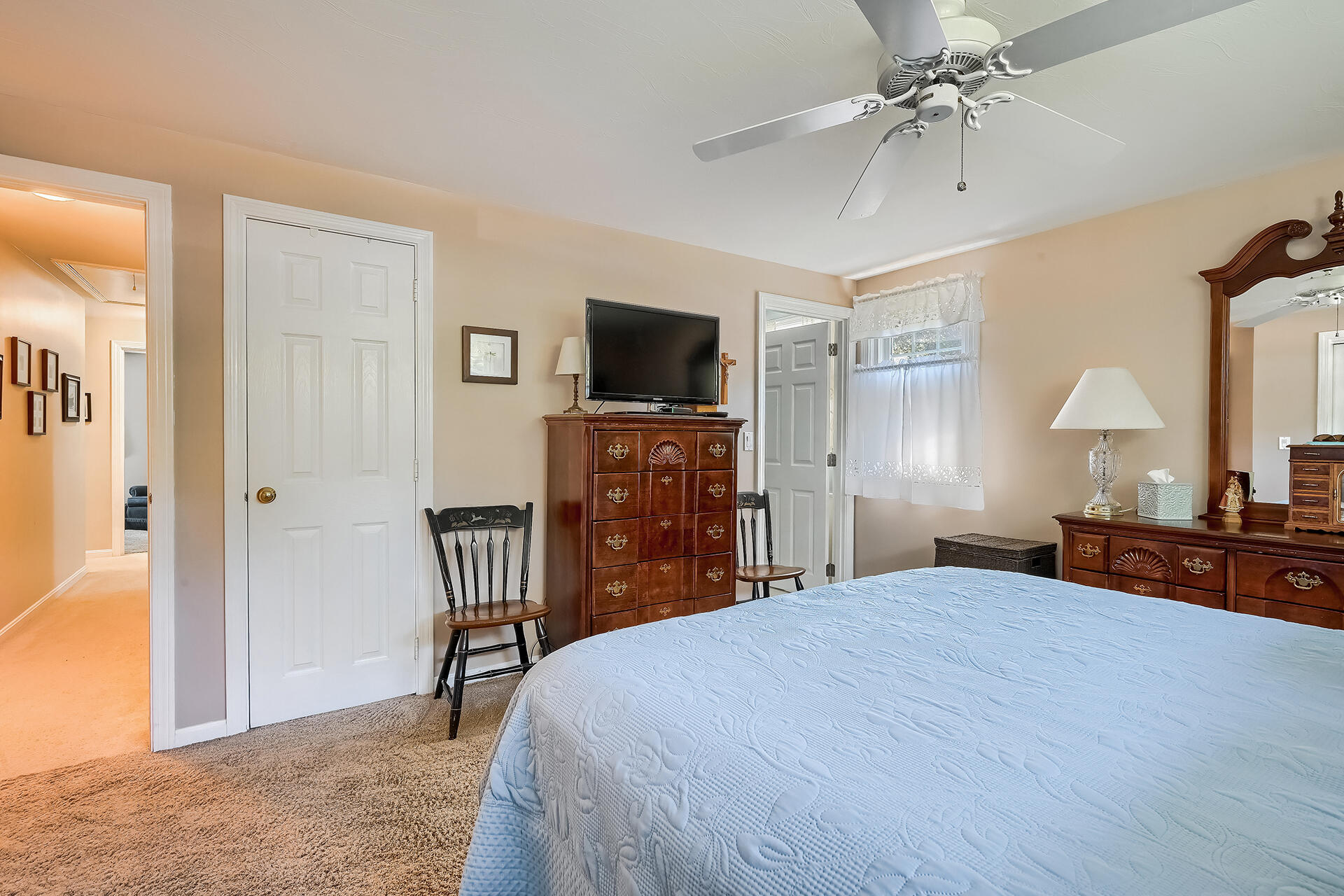 61 Merideth Way Centerville, MA 02632 - Photo 16 of 32 a bedroom with a bed and a flat screen tv