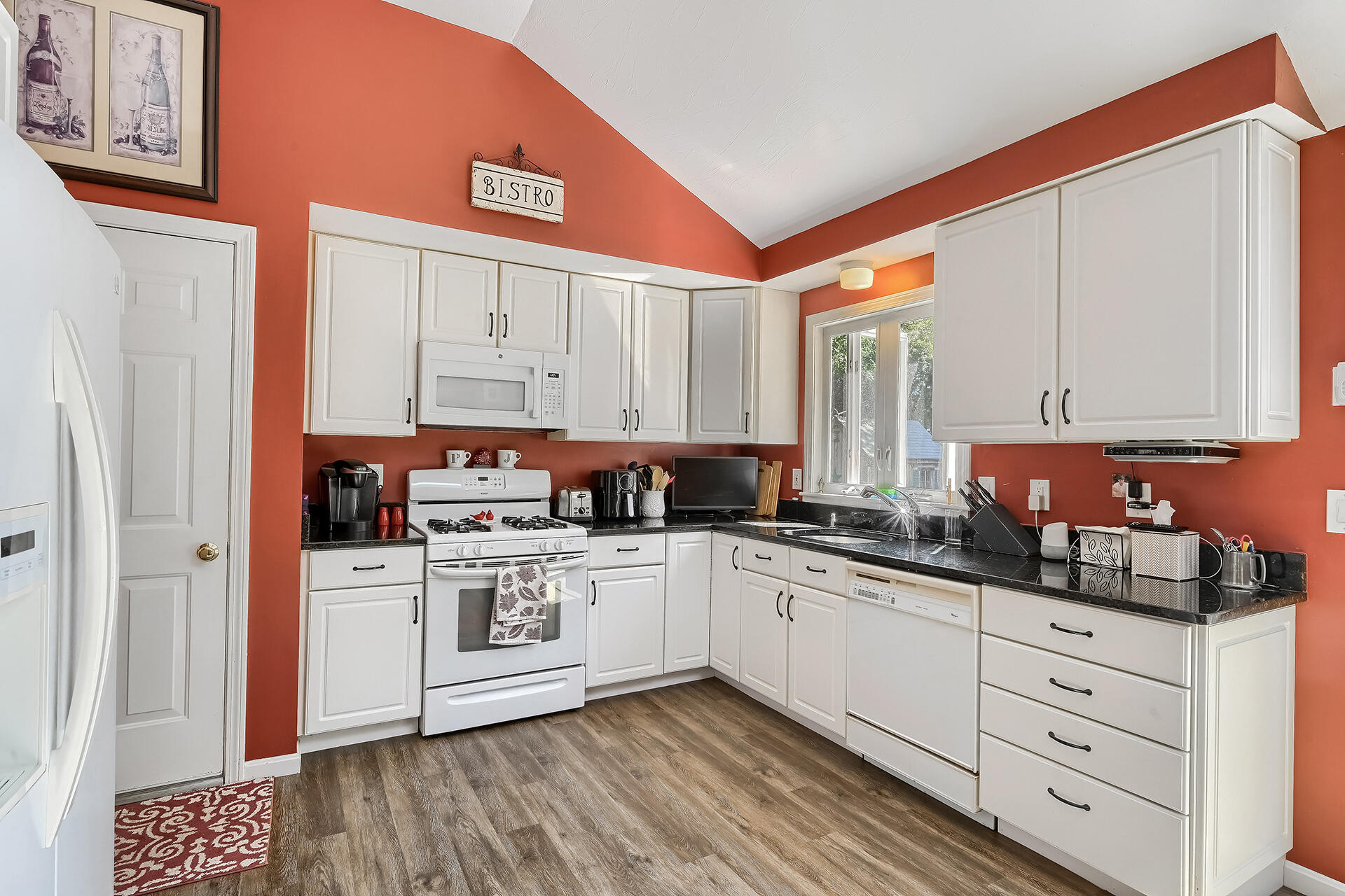 61 Merideth Way Centerville, MA 02632 - Photo 8 of 32 a kitchen with stainless steel appliances granite countertop a sink and cabinets