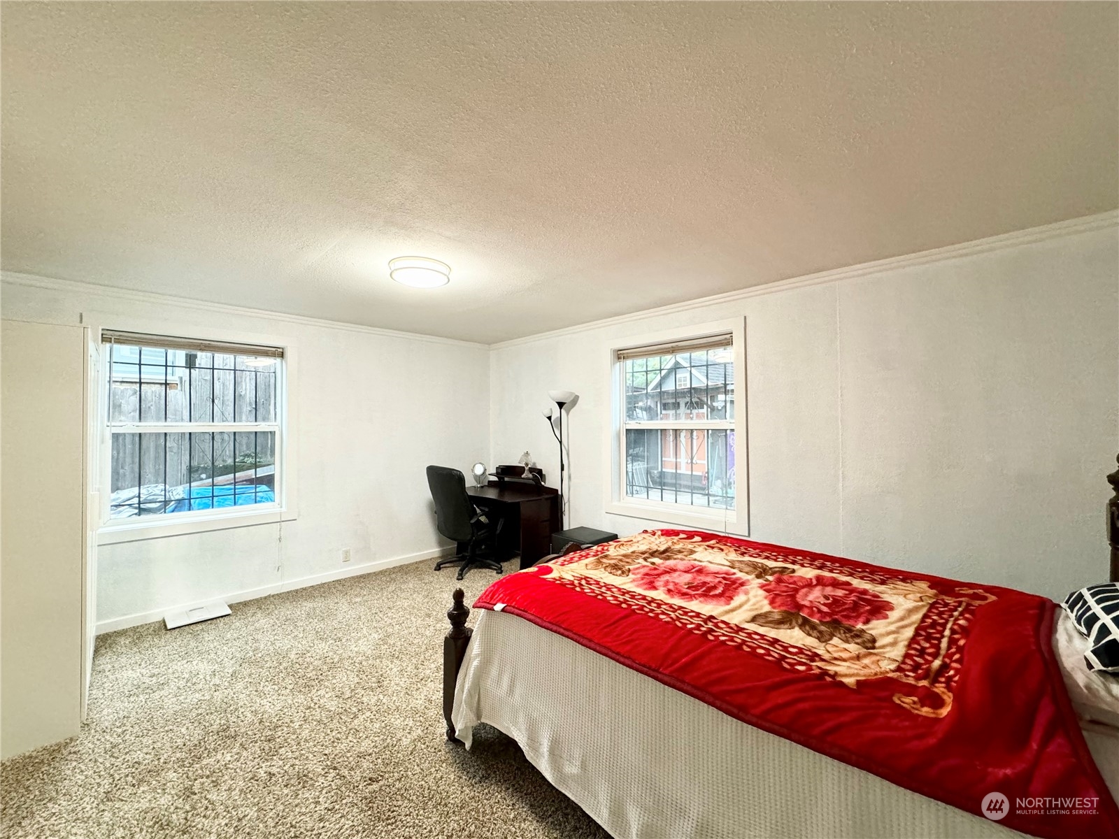 523 Main Avenue South Renton, WA 98057 - Photo 15 of 32 a bedroom with a bed and wooden floor