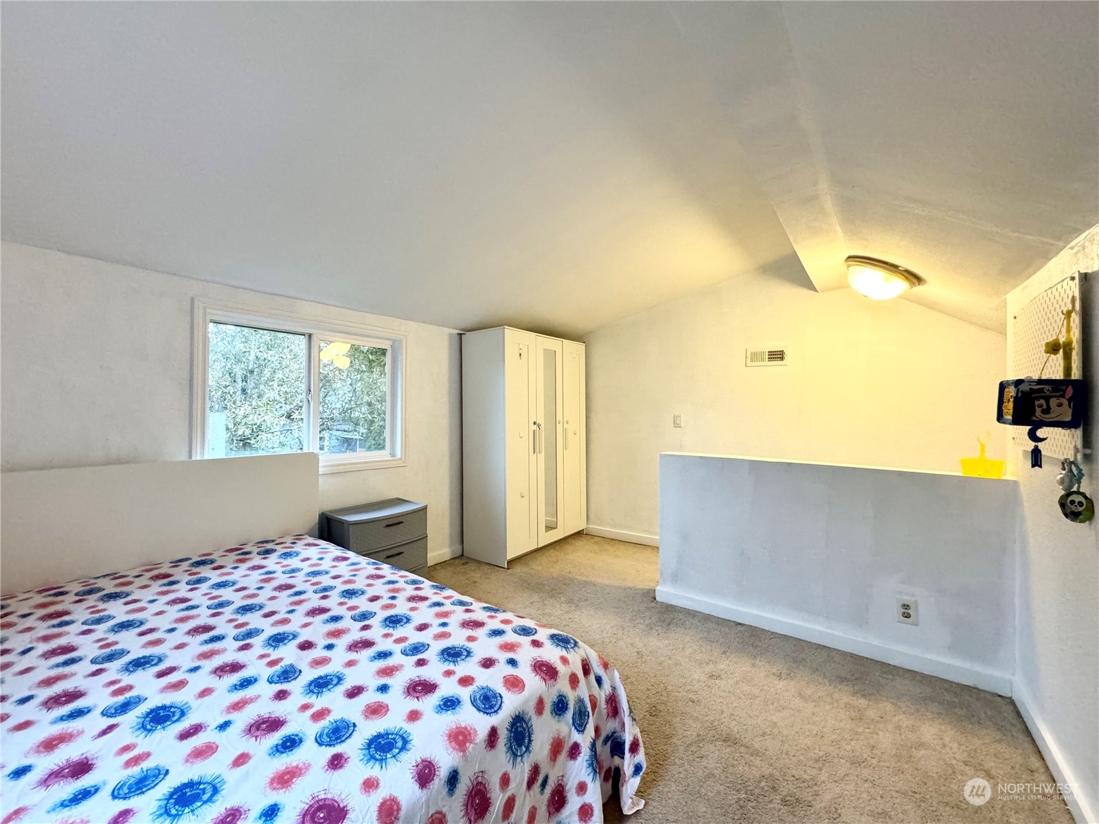 523 Main Avenue South Renton, WA 98057 - Photo 22 of 32 a bedroom with a bed and a window