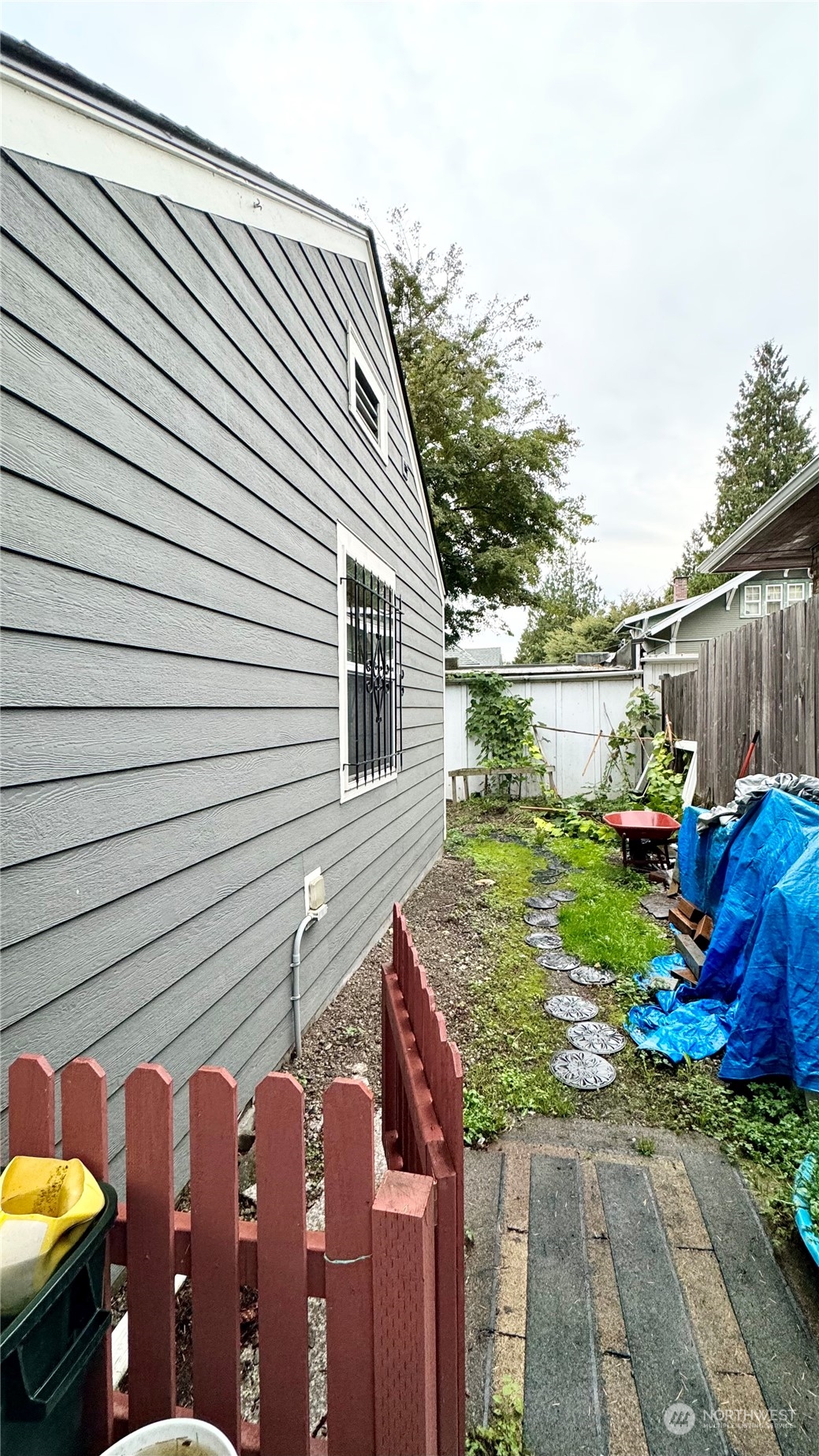 523 Main Avenue South Renton, WA 98057 - Photo 27 of 32 a view of a backyard with chairs and a fire pit