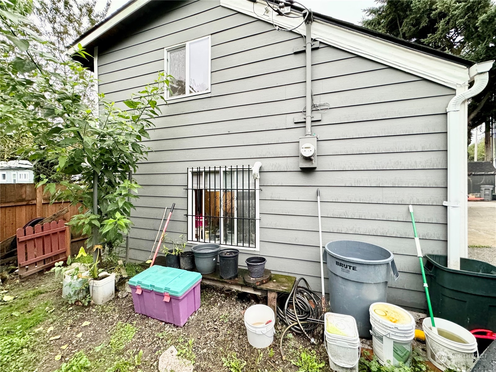 523 Main Avenue South Renton, WA 98057 - Photo 30 of 32 a view of a patio with couches chairs and potted plants