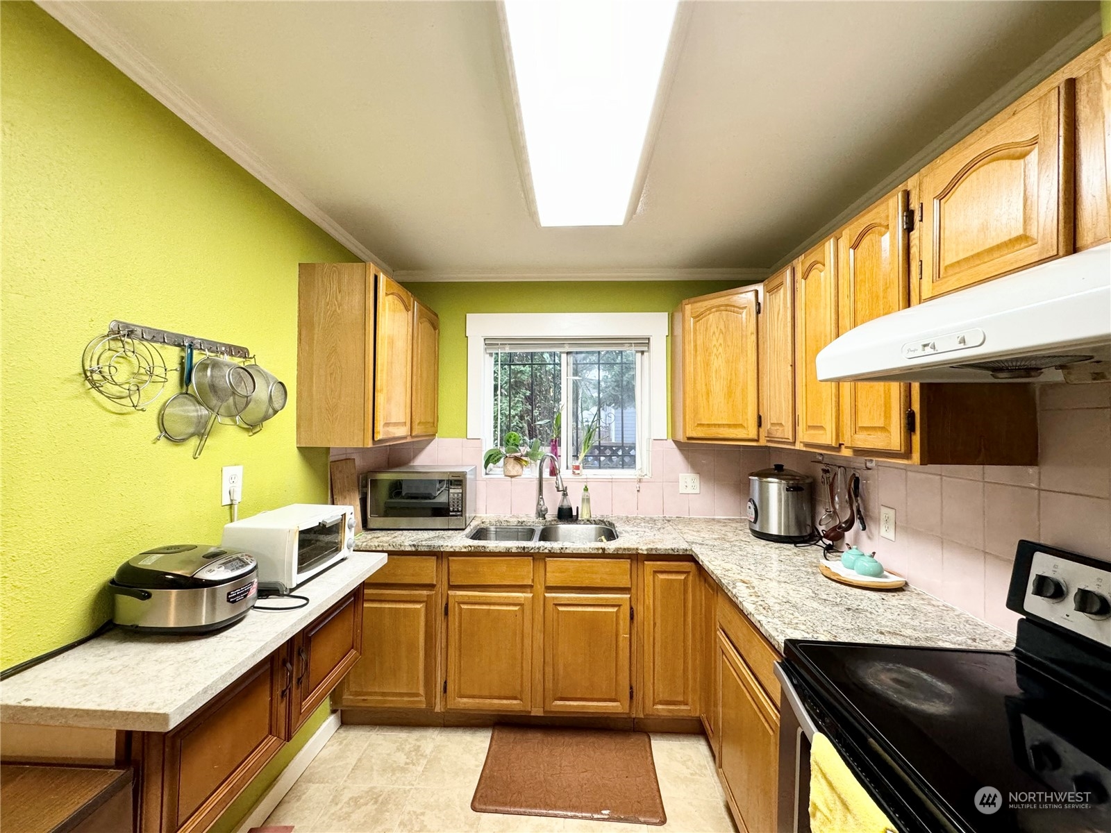 523 Main Avenue South Renton, WA 98057 - Photo 9 of 32 a kitchen with a sink and a stove top oven