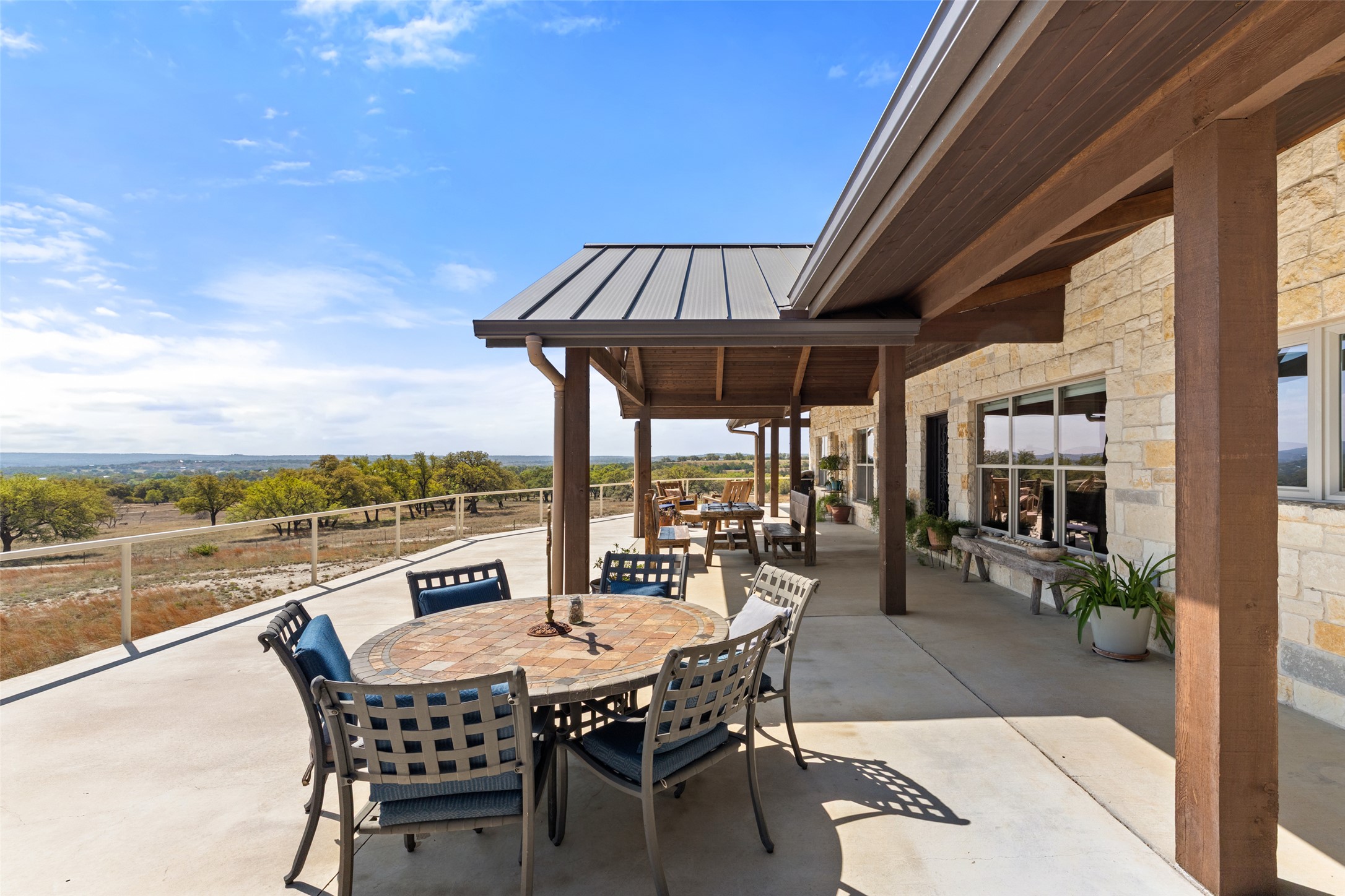 546 Lazy Oak Road Hye, TX 78635 - Photo 16 of 34 an outdoor view from a dining room with furniture