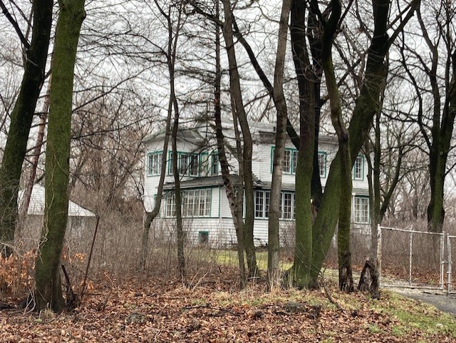 9312 Shermer Road Morton Grove, IL 60053 - Photo 1 of 2 a front view of a house with trees