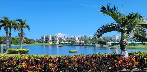 a view of a lake with a building in the background
