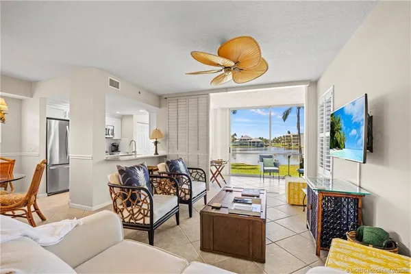 a dining room table chair and chandelier
