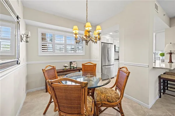 a kitchen with stainless steel appliances granite countertop a stove a refrigerator a microwave a sink and dishwasher