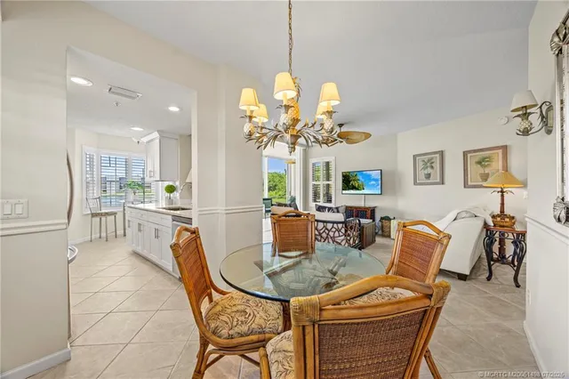a large kitchen with kitchen island a sink a counter space and a large window