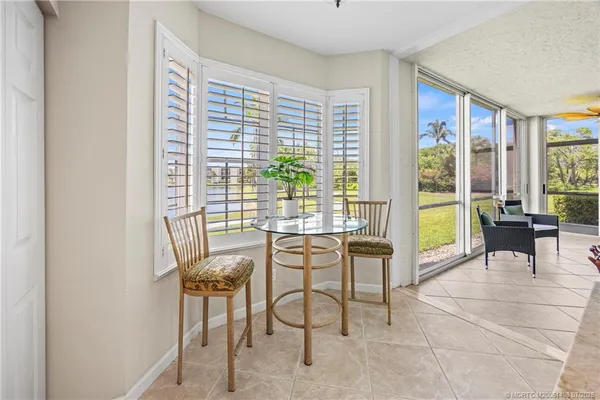 a bed room with a bed and a chandelier