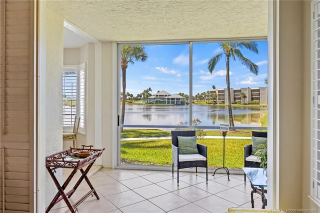 a bathroom with a double vanity sink mirror and bathtub