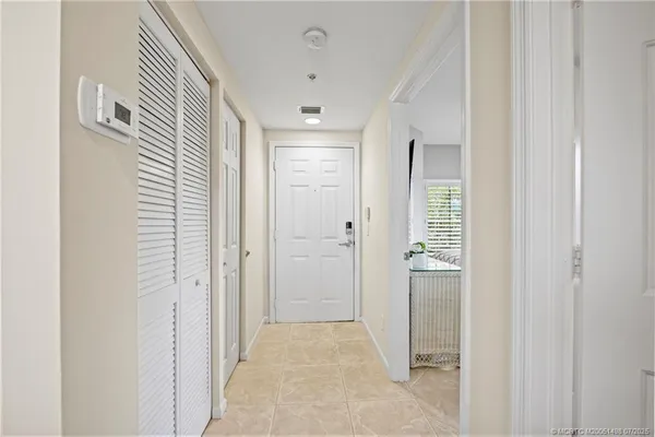 a living room with furniture a rug and a window