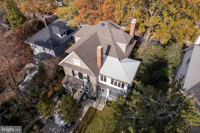 a kitchen with stainless steel appliances a stove and white cabinets