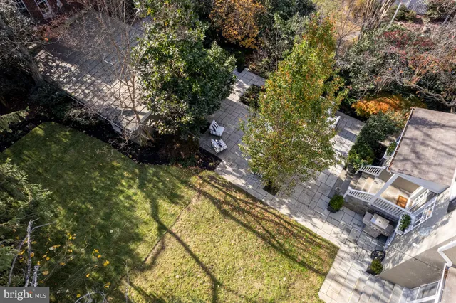 a kitchen with granite countertop white cabinets and wooden floor