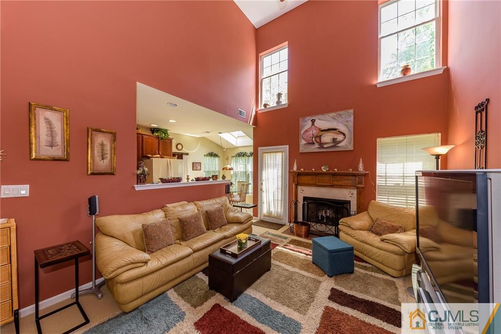 3 Rock Run Road East Windsor, NJ 08520 - Photo 11 of 25 a living room with furniture and a fireplace