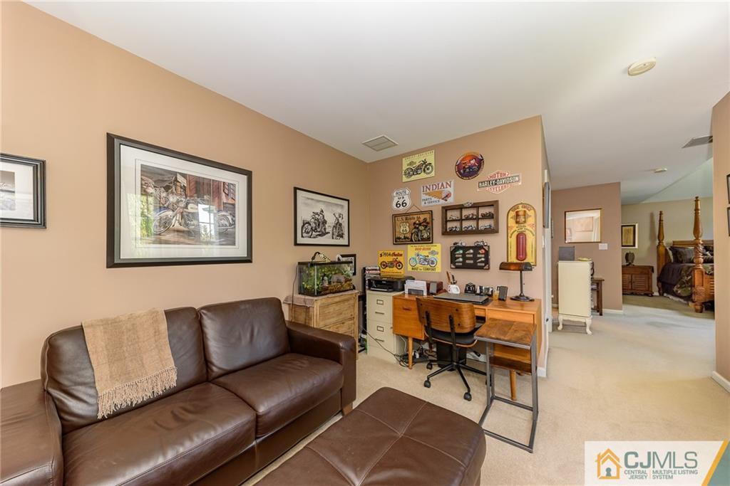 3 Rock Run Road East Windsor, NJ 08520 - Photo 18 of 25 a living room with furniture and painting on the wall
