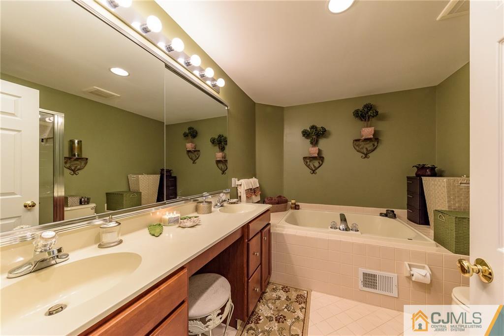 3 Rock Run Road East Windsor, NJ 08520 - Photo 19 of 25 a bathroom with a tub sink and mirror
