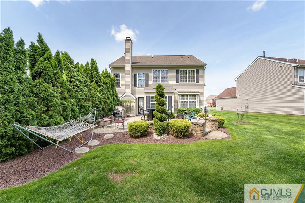 3 Rock Run Road East Windsor, NJ 08520 - Photo 24 of 25 a front view of a house with a garden and yard