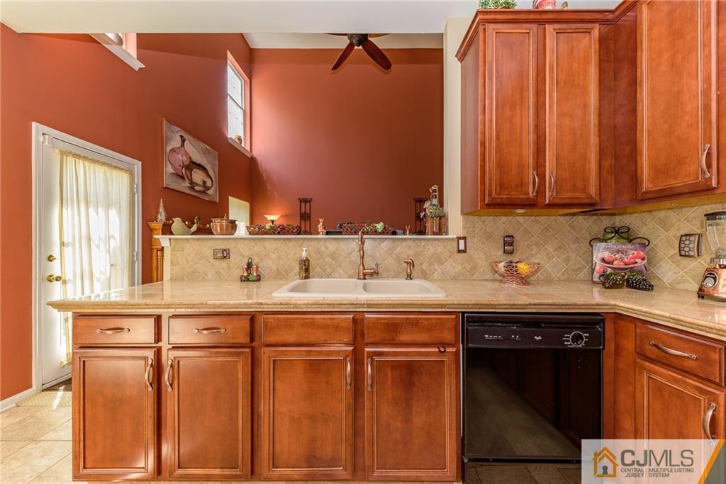 3 Rock Run Road East Windsor, NJ 08520 - Photo 6 of 25 a kitchen with stainless steel appliances granite countertop a sink and cabinets