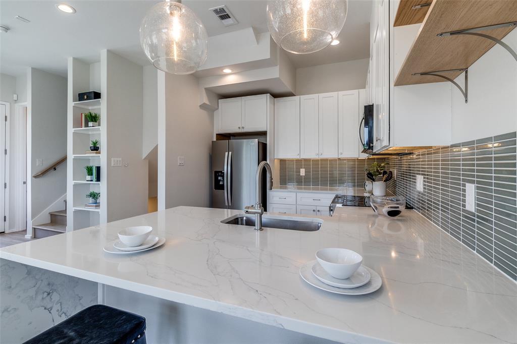 3308 Birmingham Avenue, Unit A1 Dallas, TX 75210 - Photo 18 of 33 a bathroom with a sink and a mirror