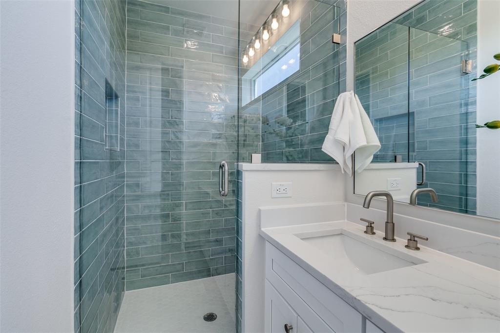 3308 Birmingham Avenue, Unit A1 Dallas, TX 75210 - Photo 28 of 33 a bathroom with a sink and a shower