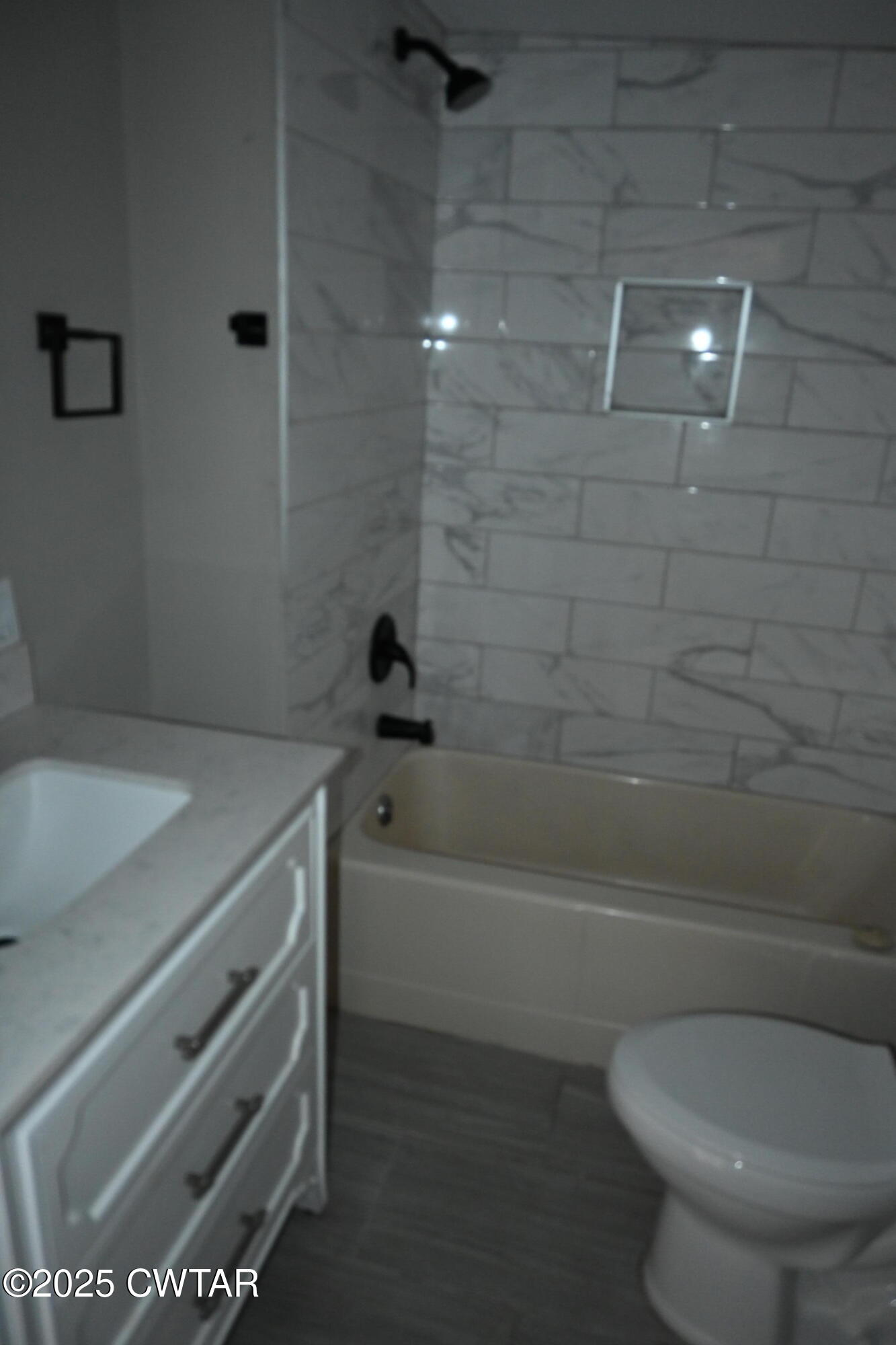 425 North McCombs Street Martin, TN 38237 - Photo 14 of 21 a bathroom with a toilet and a bathtub