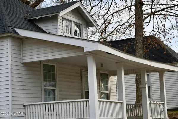 a view of a house with a large window