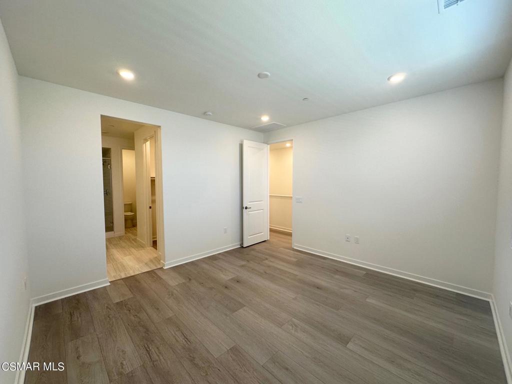 10726 Telegraph Road Ventura, CA 93004 - Photo 8 of 25 a view of an empty room with wooden floor